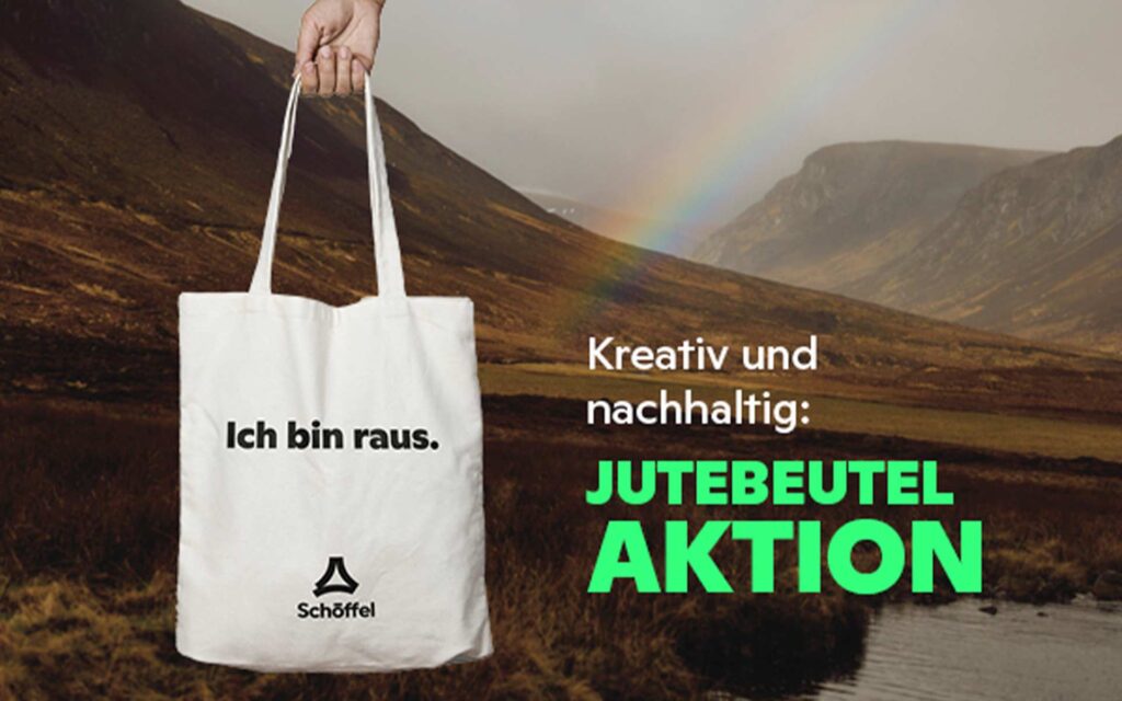 Hand hält Jutebeutel von Schöffel mit Druck