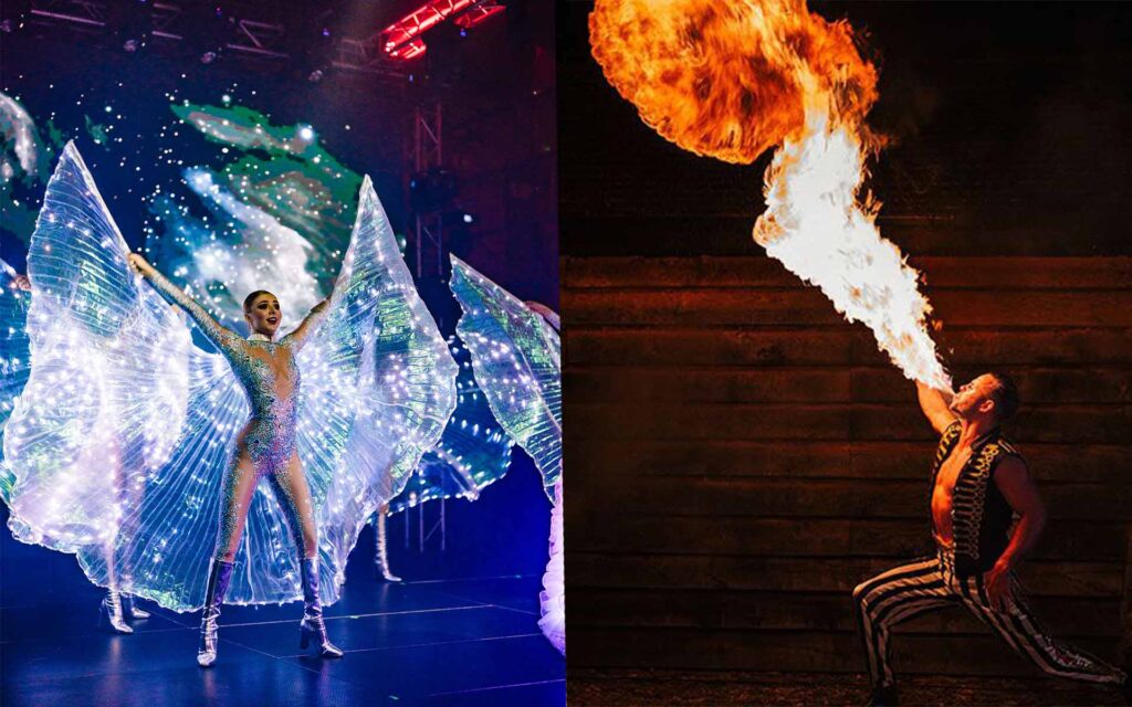 Frau in leuchtendem Umhang und Feuerspucker