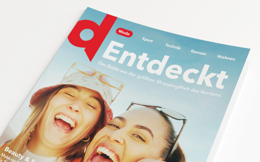 Prospekt mit zwei lachenden Frauen auf dem Cover